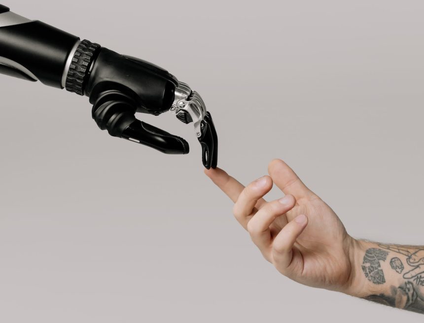 bionic hand and human hand finger pointing
